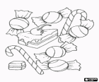 Různé bonbony nebo sladkosti - bonbony, cukrovinky tyčinky a kus koláče