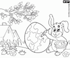 Jste připraveni na příchod Velikonoc, králík maluje velikonoční vajíčko
